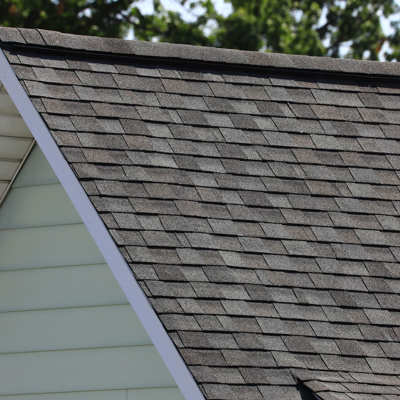 A close up of a roof with shingles on it.