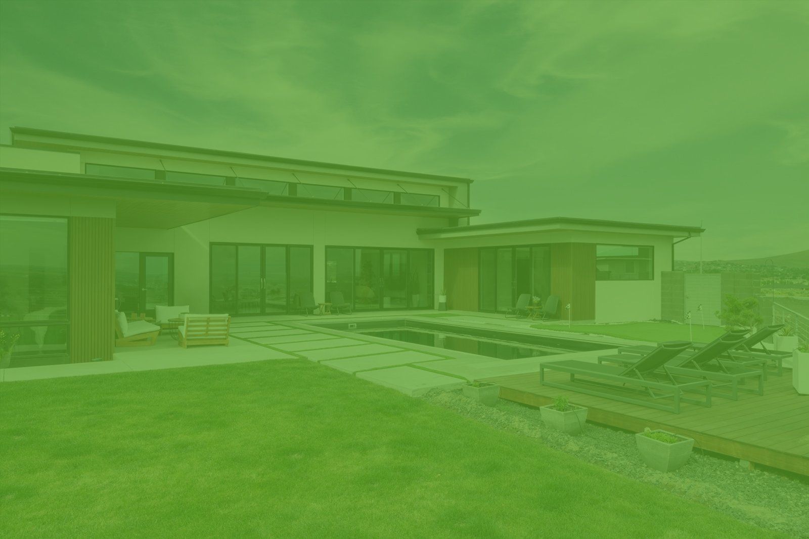 A green background of a house with a swimming pool in the backyard.