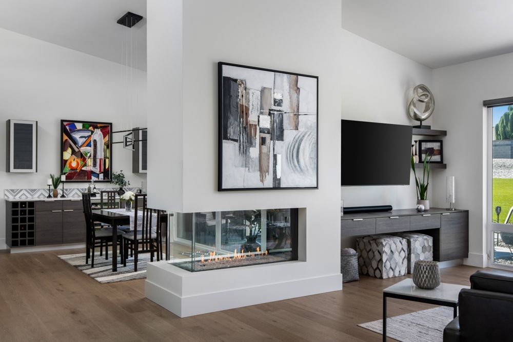 There is a fireplace in the middle of the living room.