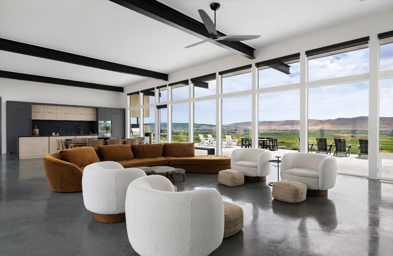 An aerial view of a house with a large swimming pool in the backyard.