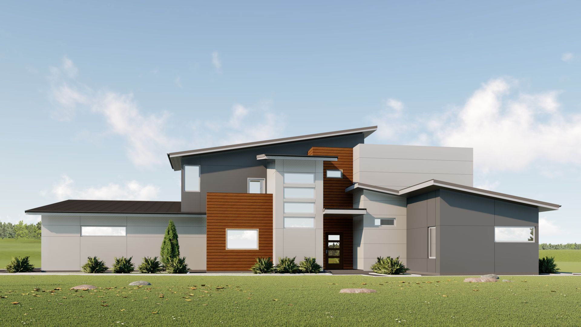 A large house with a lot of windows is sitting on top of a lush green field.