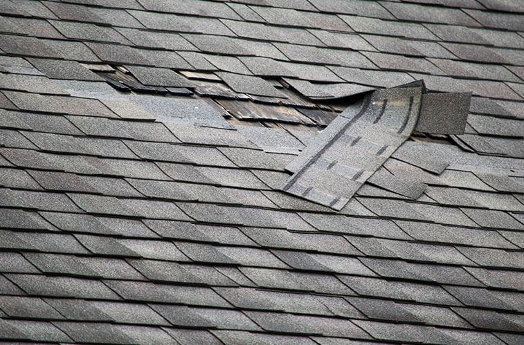 A close up of a roof with a hole in it.
