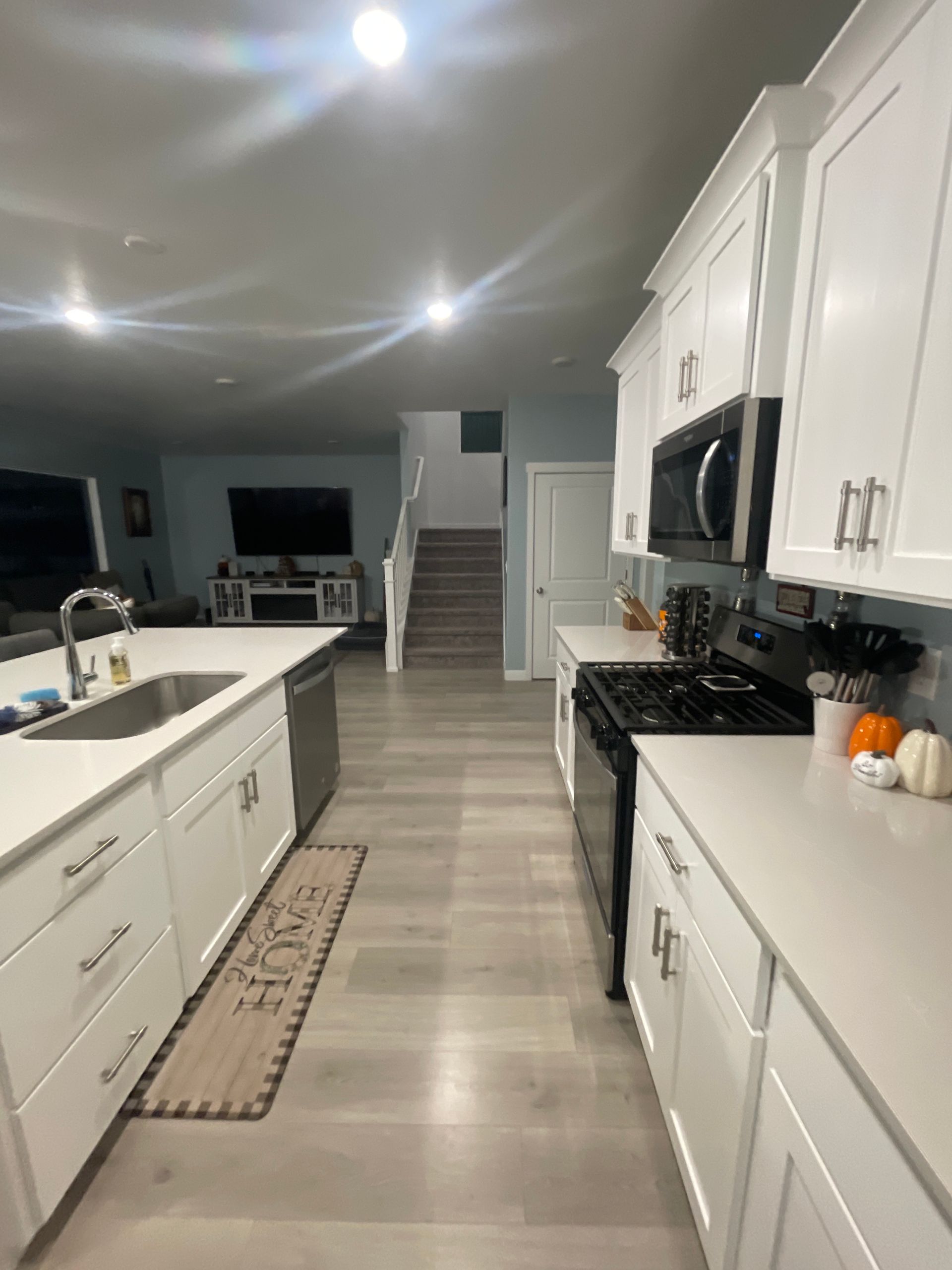 Laminate flooring installed in a kitchen remodel by Elevate Builders