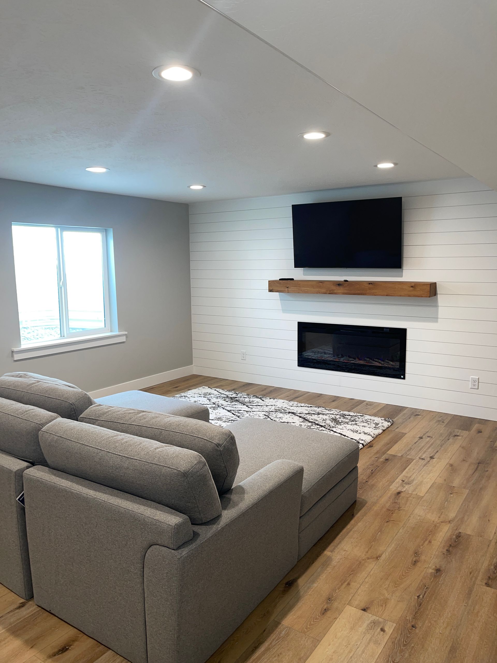 A living room with a couch and a flat screen tv