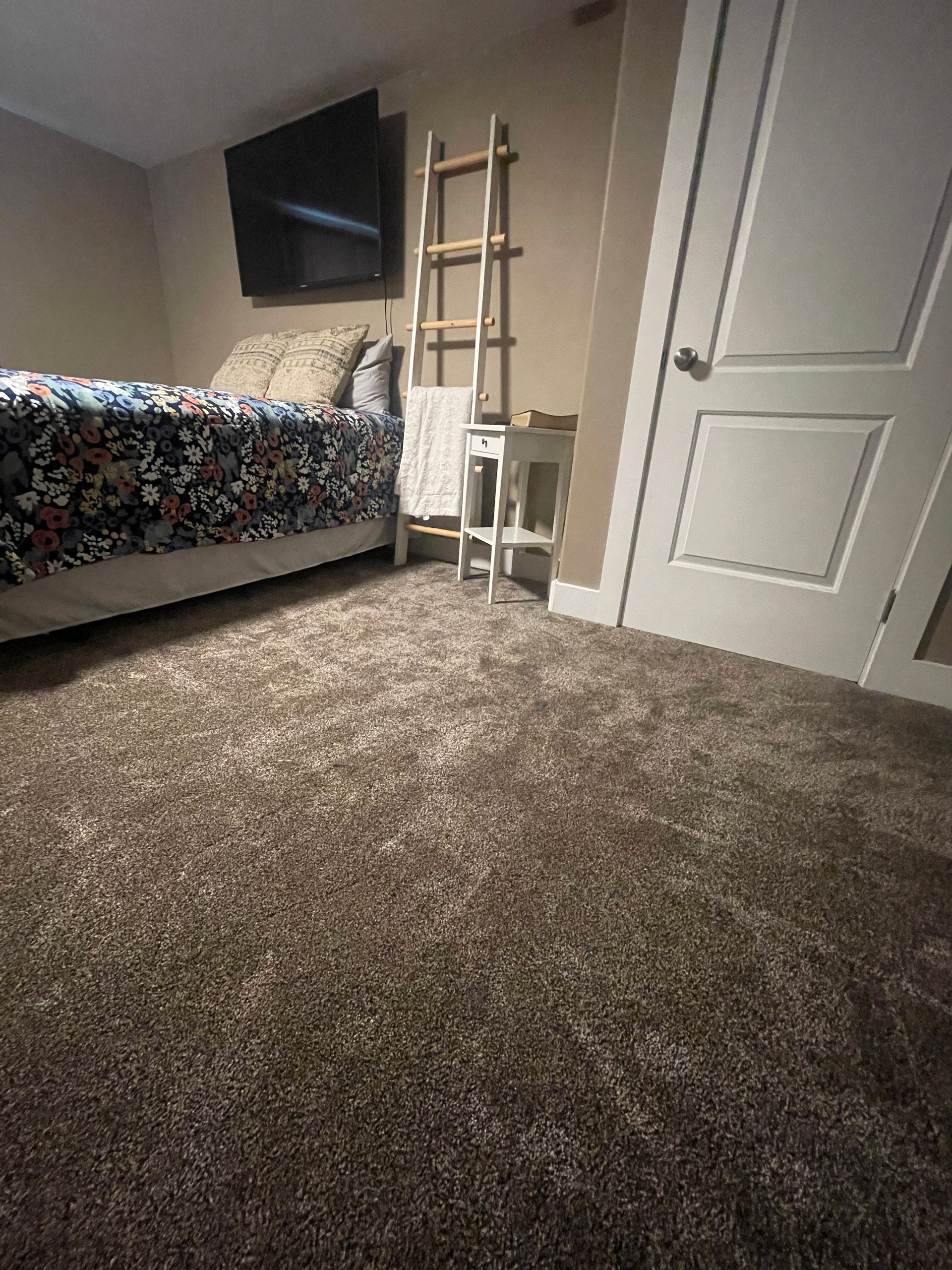 Bedroom with new carpet installed by utah's best flooring contractor Elevate Builder