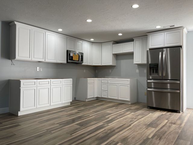 Newely remodeled kitchen with white cabinets