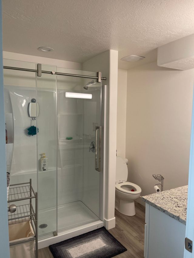 Finished bathroom with sliding glass door