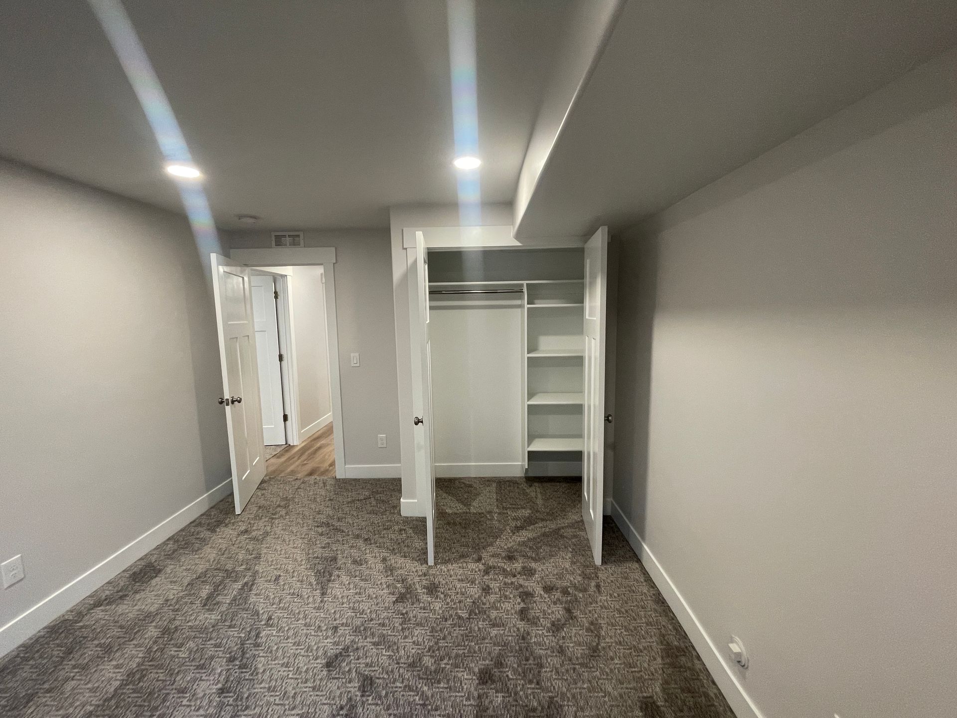 There is a closet in the corner of the room.