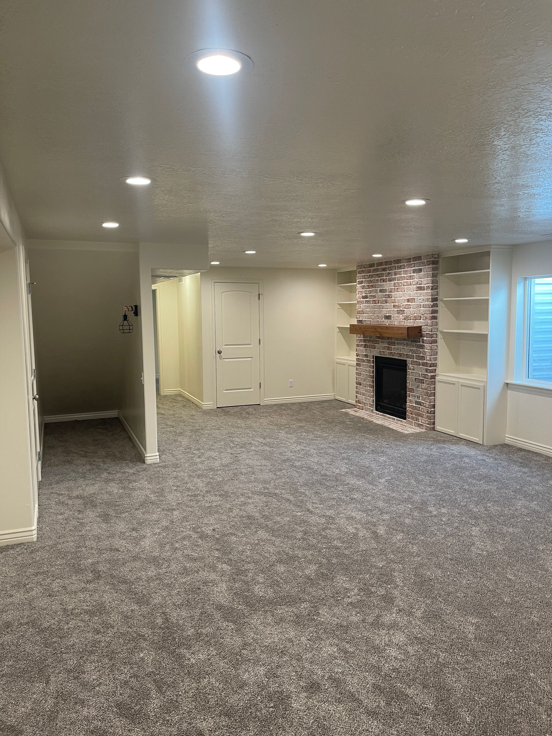 There is a fireplace in the middle of the room.