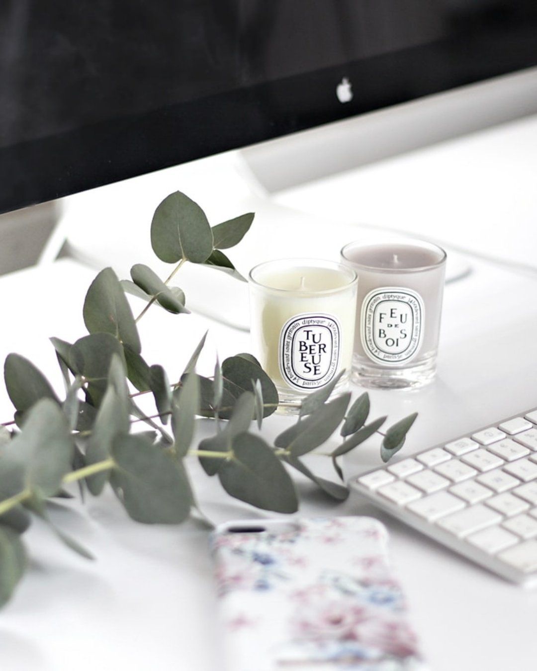 GK Marketing Online | Two candles sit on a desk next to an apple computer