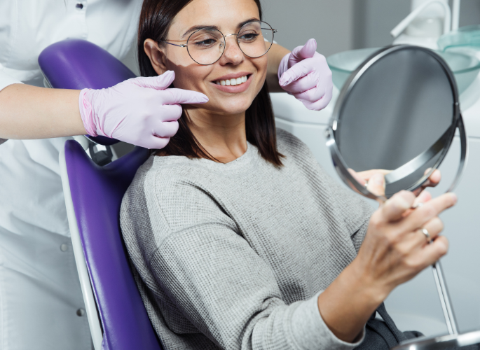 Patient taking a dental exam smiling | Teeth cleanings in Oak Point TX