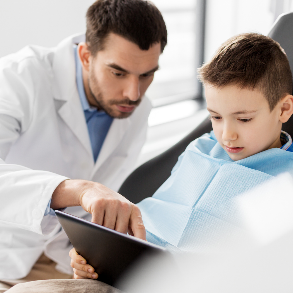 dentist showing child xrays | family dentist in oak point tx 75068