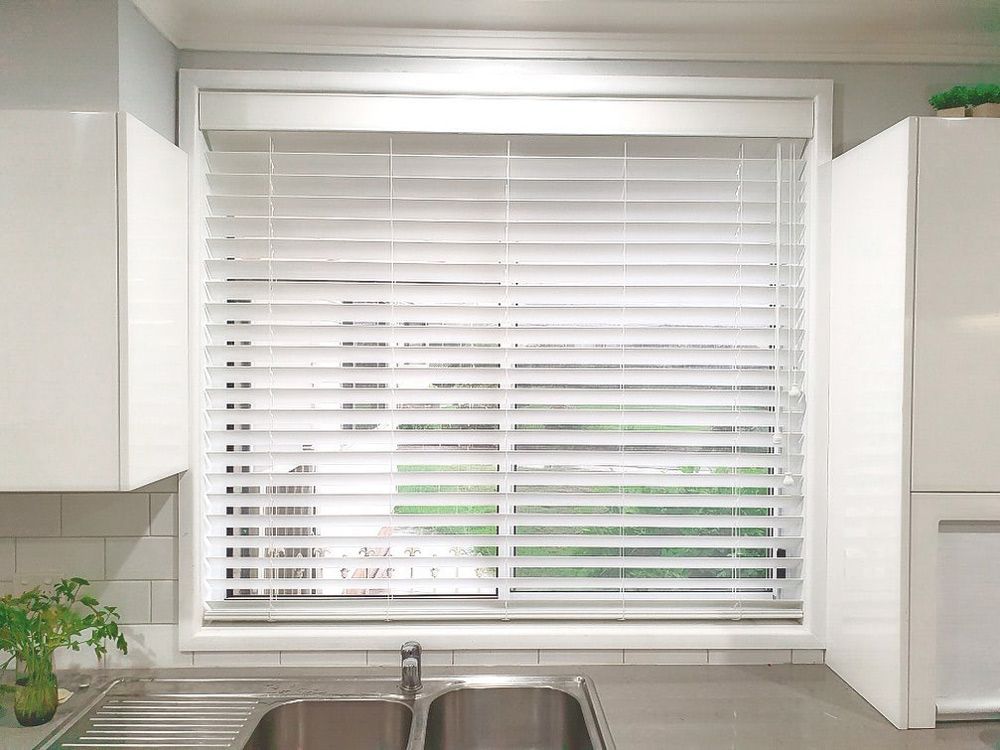 A Kitchen with A Sink and A Window with Blinds — New Blinds and Shutters in Maryland, NSW