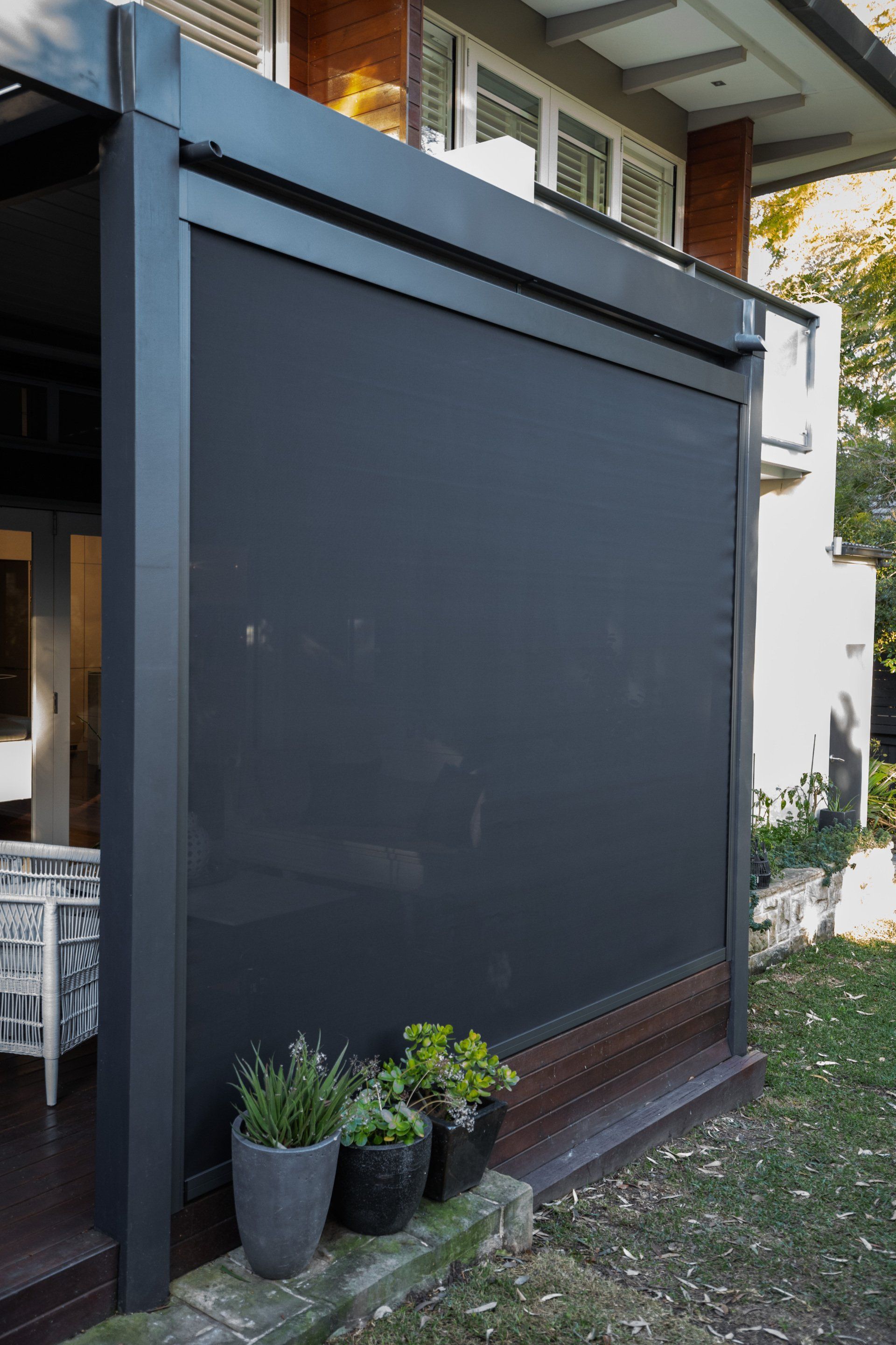 A House with A Black Screen on The Side of It — New Blinds and Shutters in Maryland, NSW