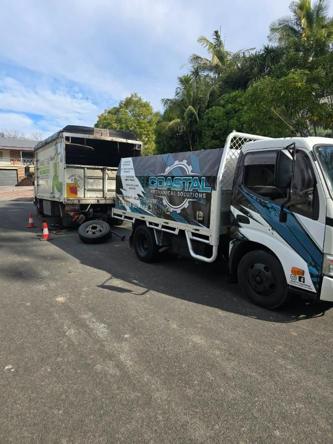 Two Trucks Are Parked Next to Each Other on The Side of The Road — Coastal Mechanical Solutions In Albion Park Rail, NSW