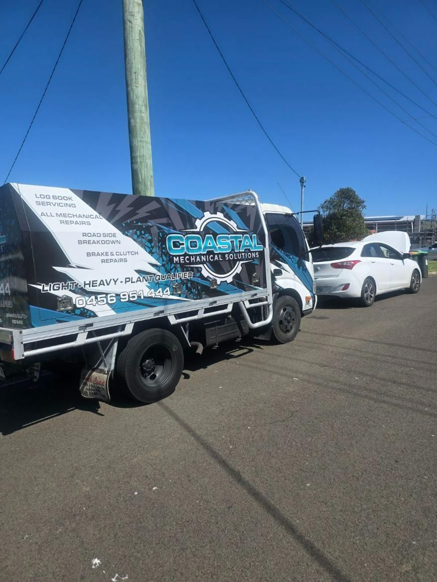 Two Tow Trucks Are Parked Next to Each Other in A Parking Lot — Coastal Mechanical Solutions In Albion Park Rail, NSW