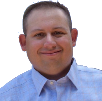 Man with short brown hair smiles, wearing a light blue button-down shirt.