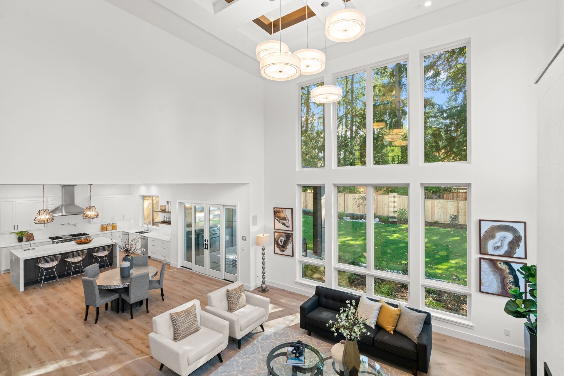 A living room with a lot of windows and a couch.