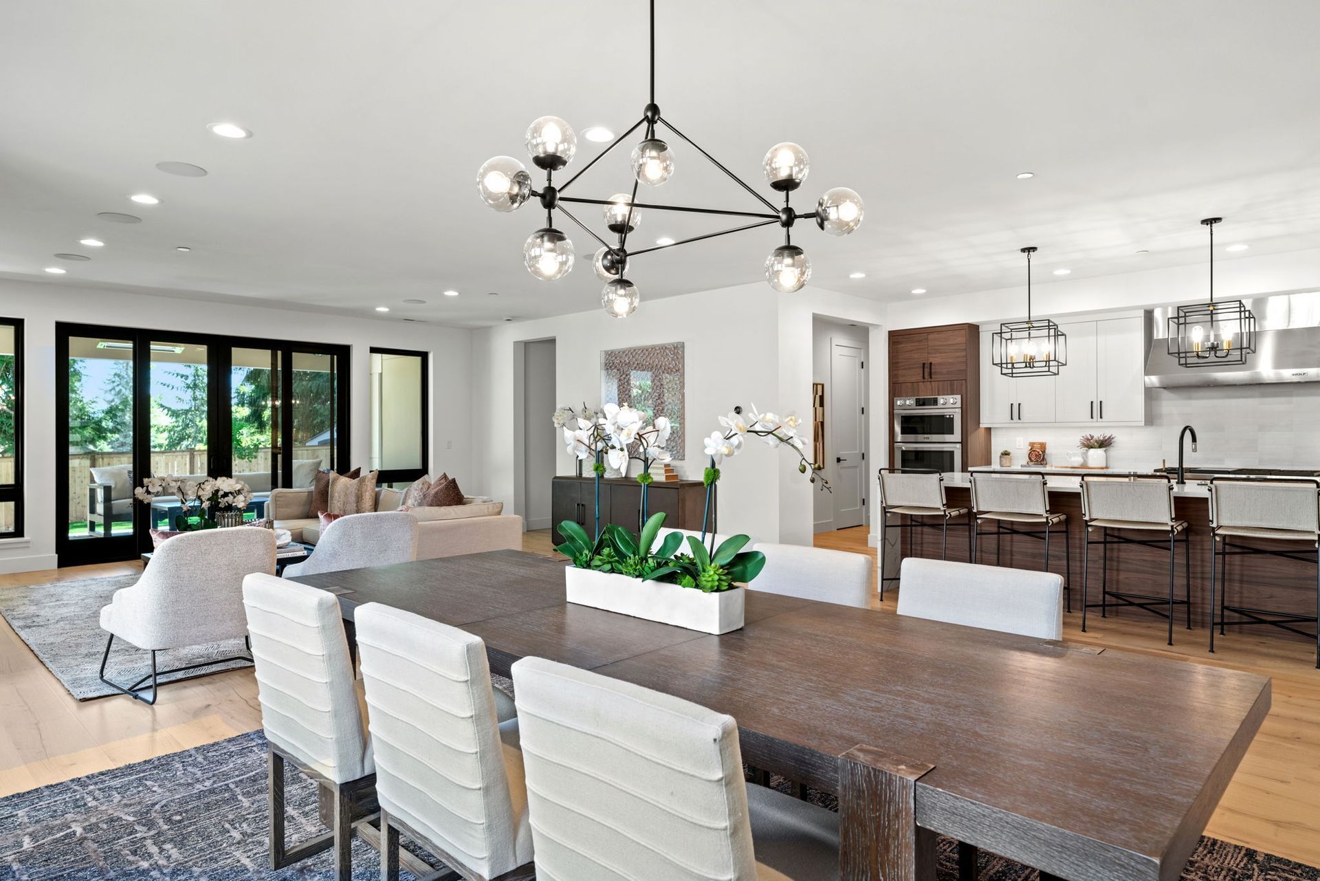 A dining table and chairs in next to the kitchen.
