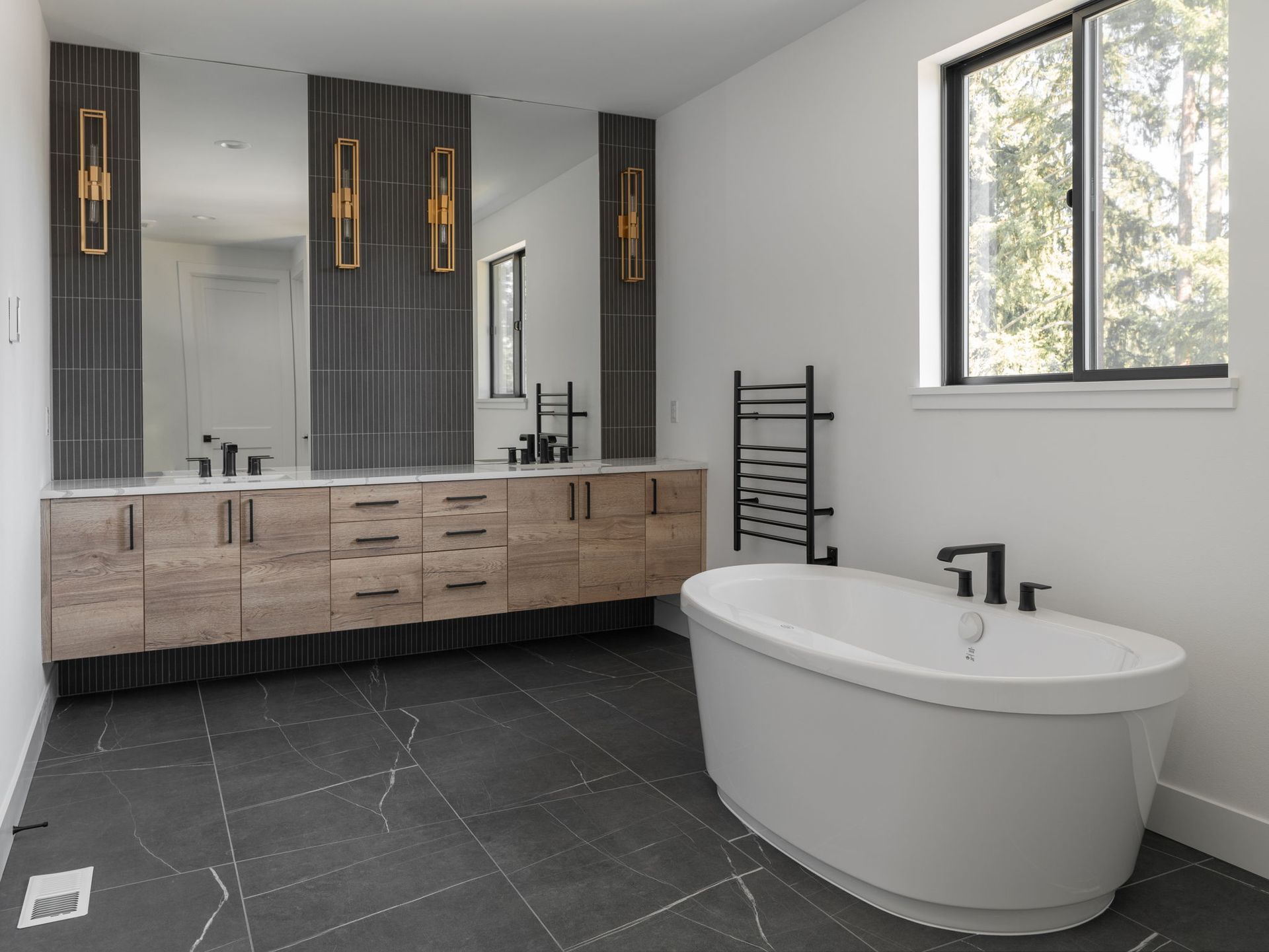 There is a bathtub in the middle of the bathroom.