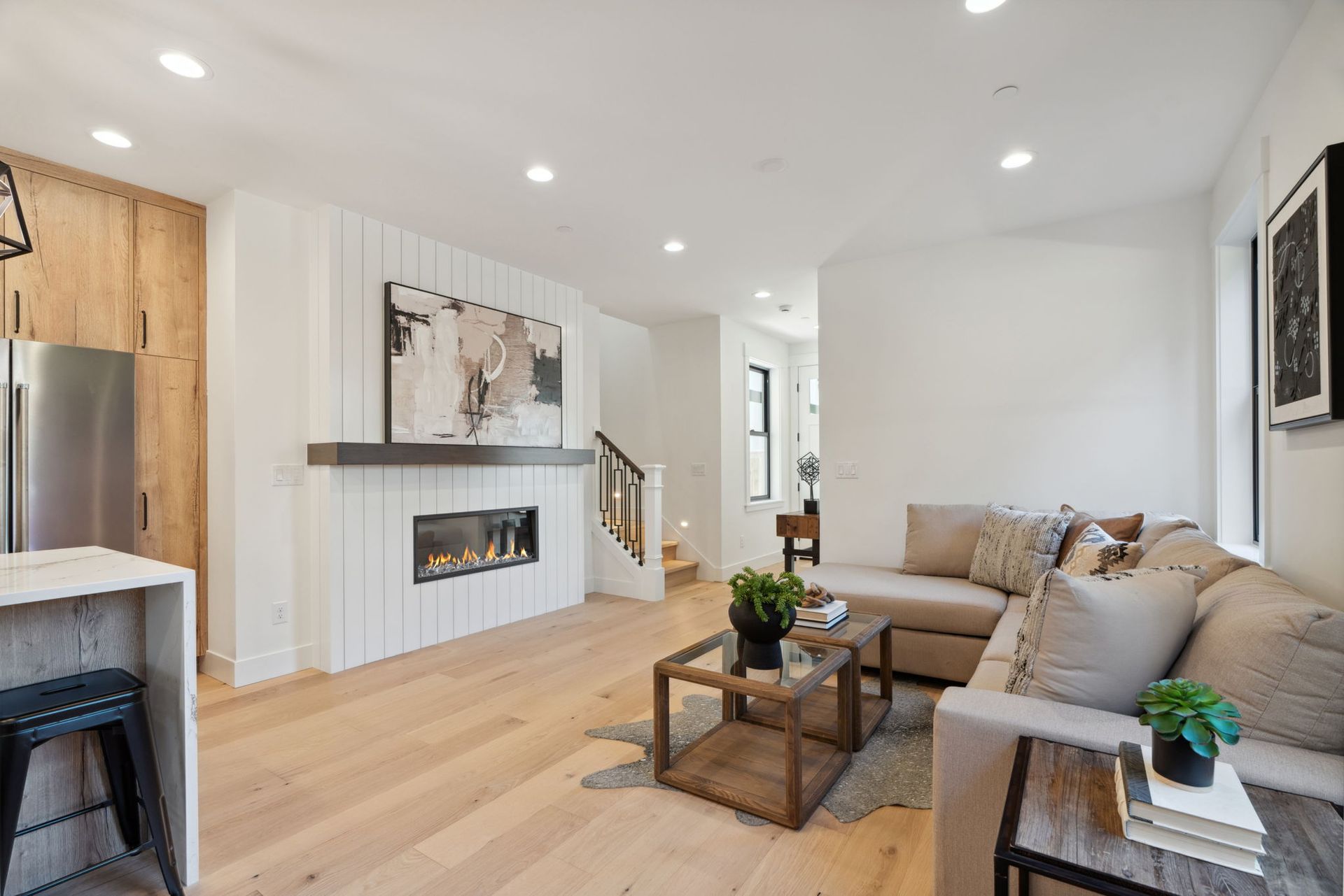 A living room with a couch and a coffee table in a house.