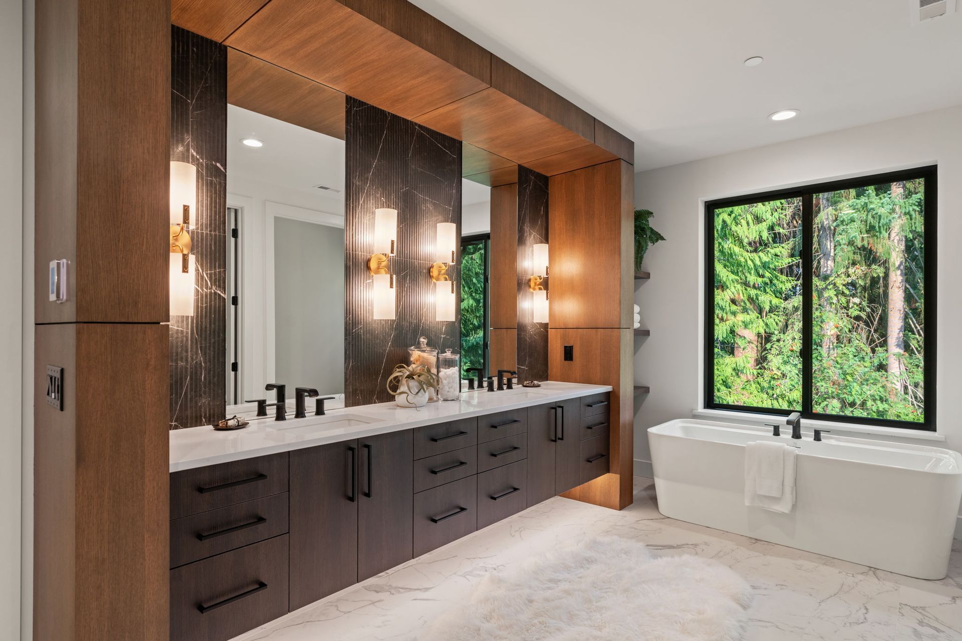 Modern bathroom with black accent wall, three windows, and wood vanity.