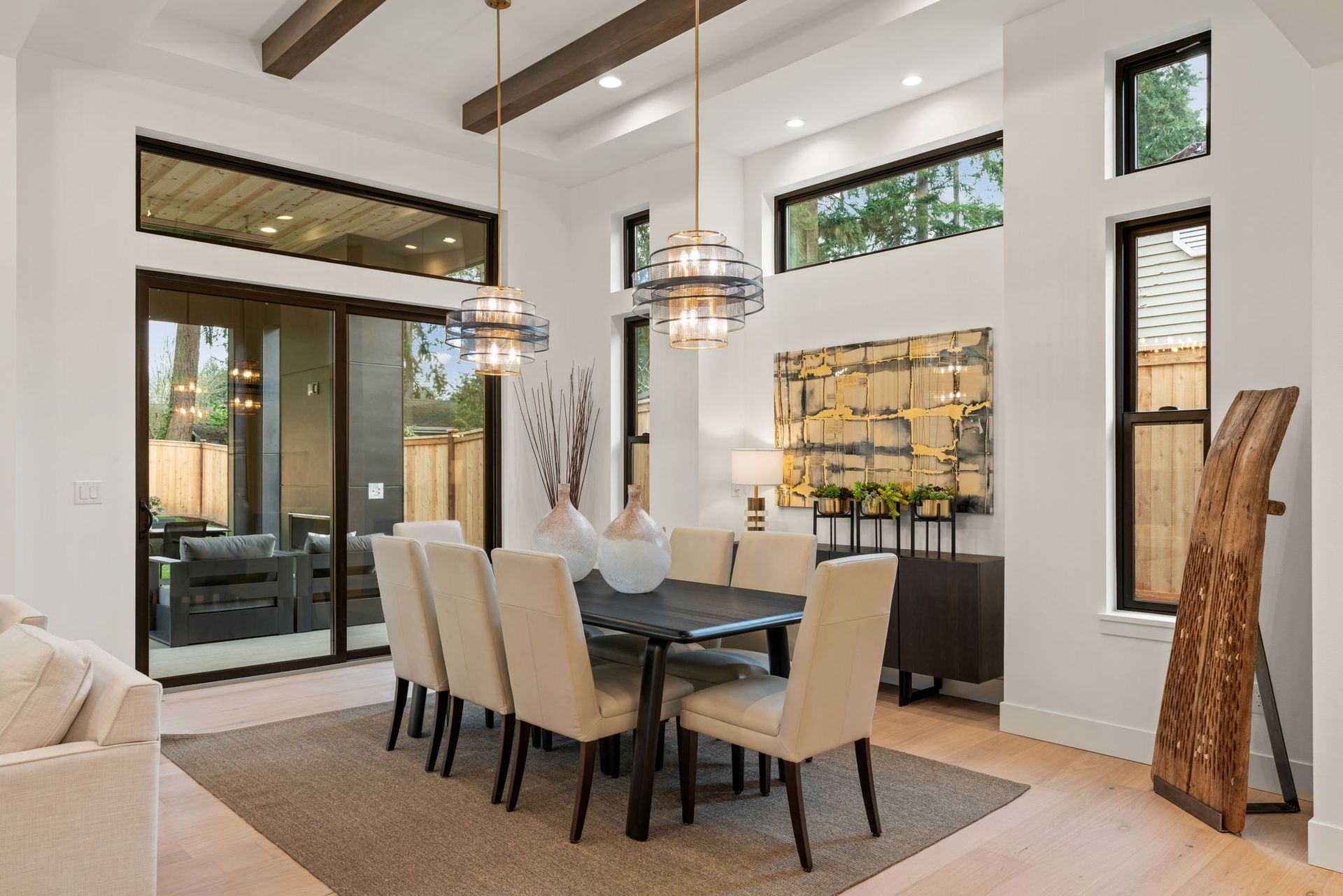 A dining room with a table and chairs in a house.