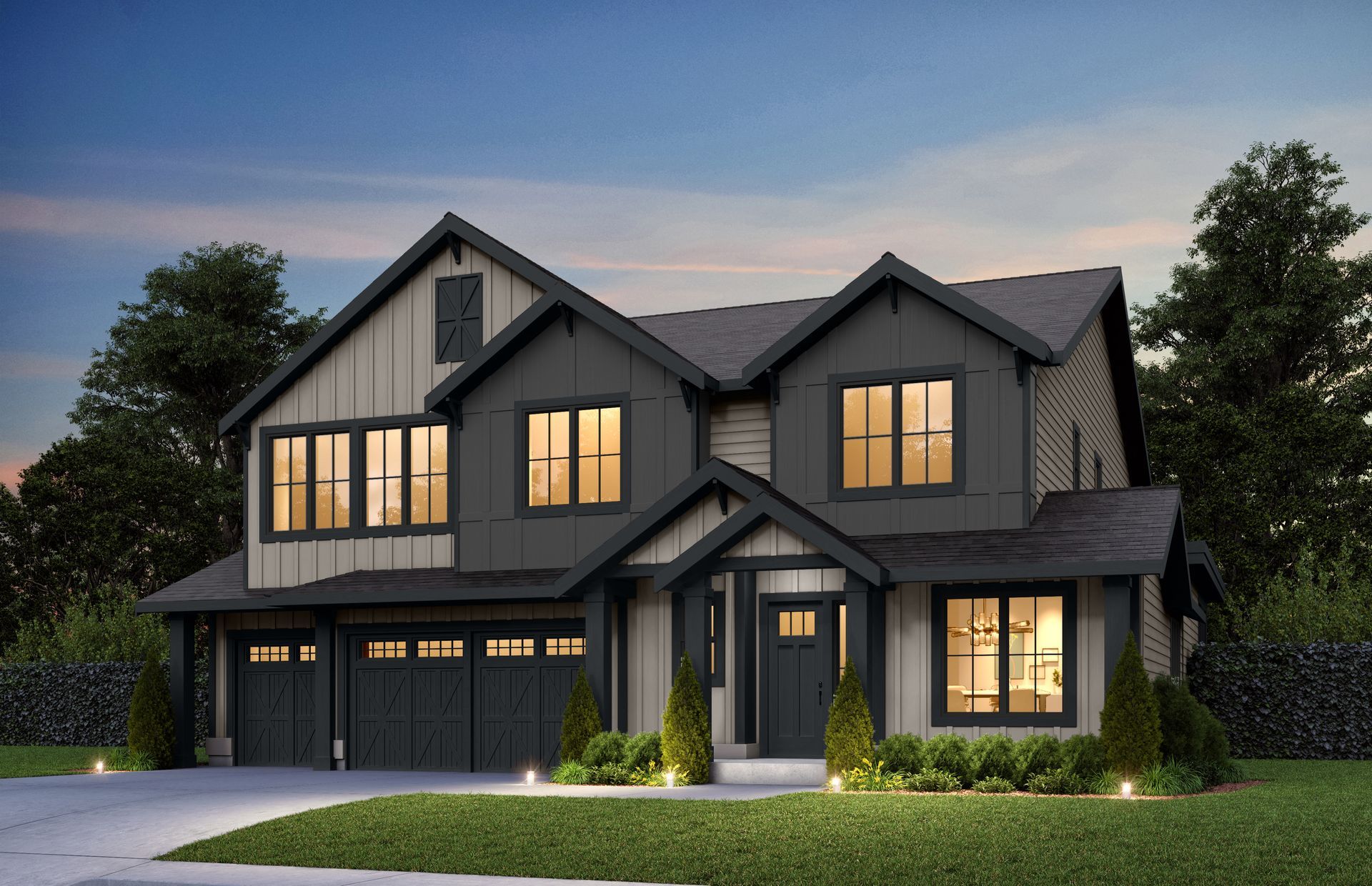 A large house with a lot of windows and a garage is sitting on top of a lush green lawn.