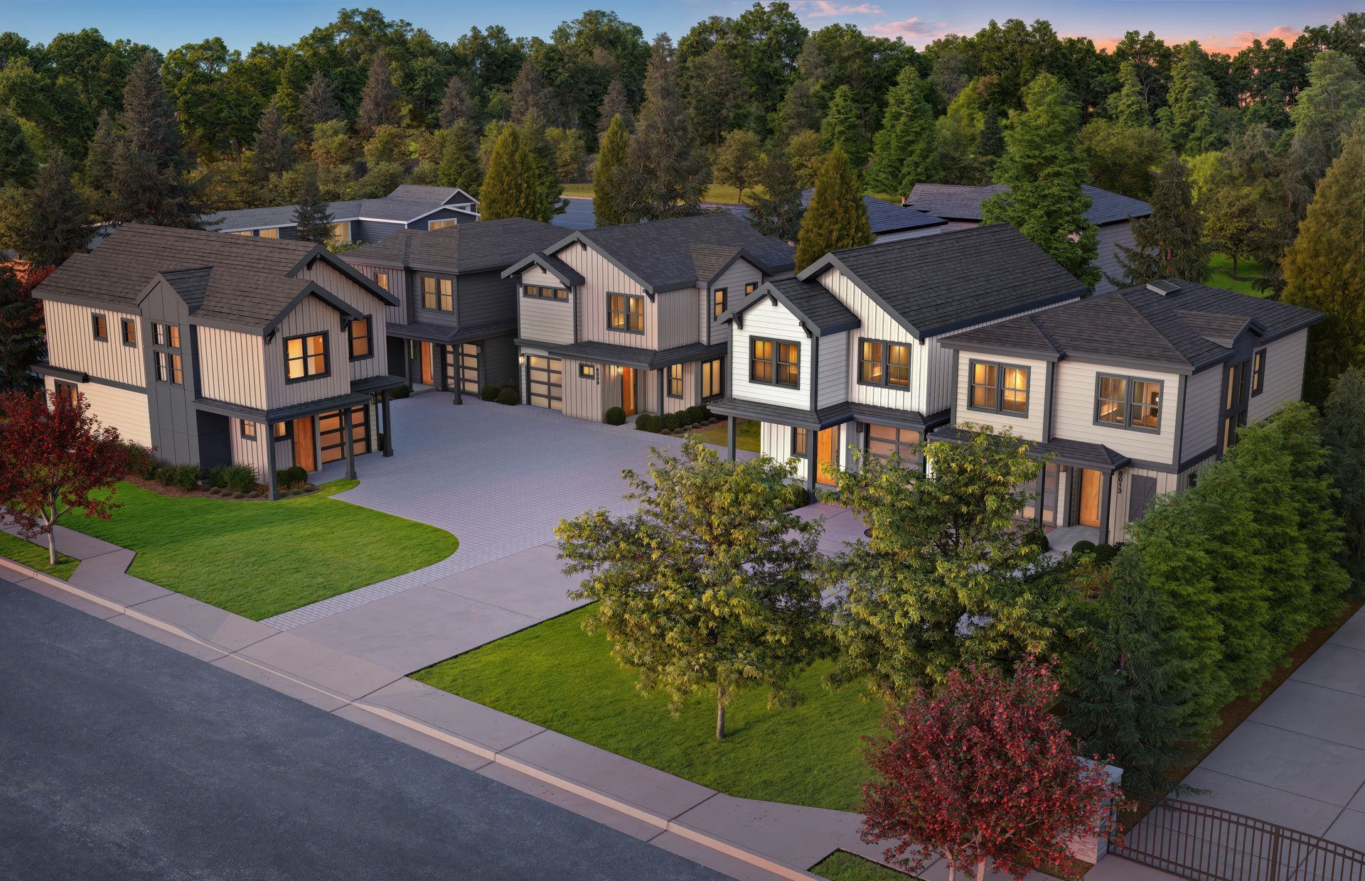 An aerial view of a row of houses with trees in the background.