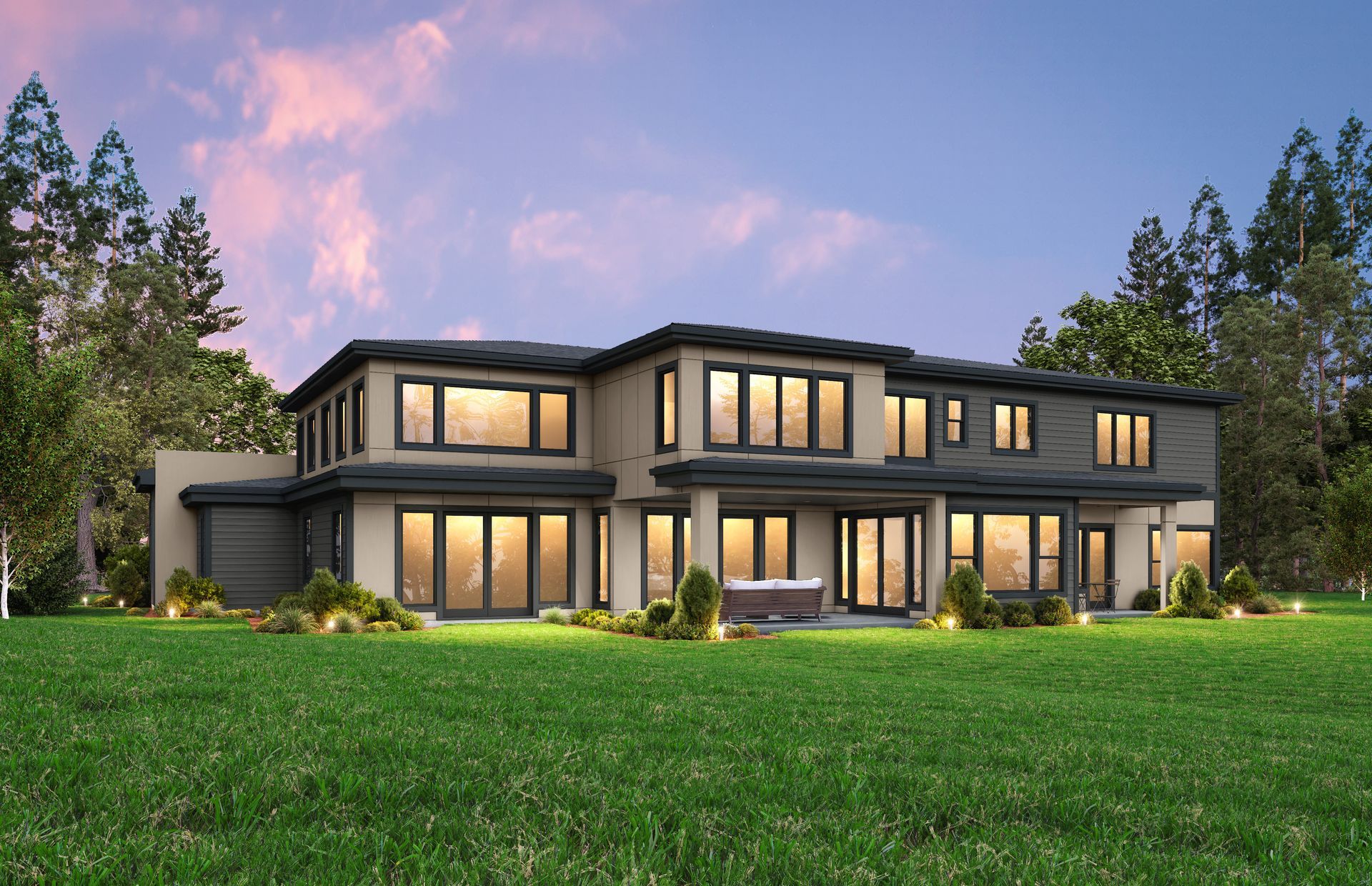 Modern two-story house with large windows, set on a green lawn with trees against a sunset sky.