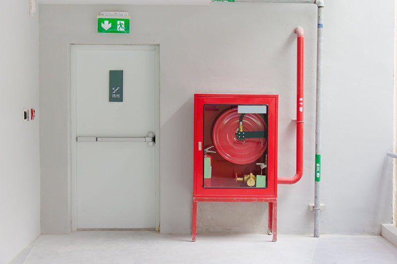 Fire Exit Door And Fire Extinguish Equipment — Safe Industries Group Mid North Coast NSW