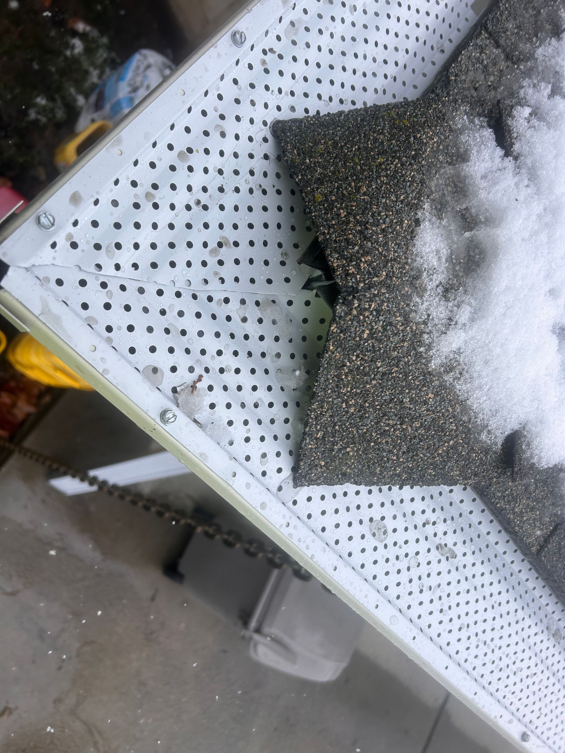 A piece of concrete is sitting on top of a white grid