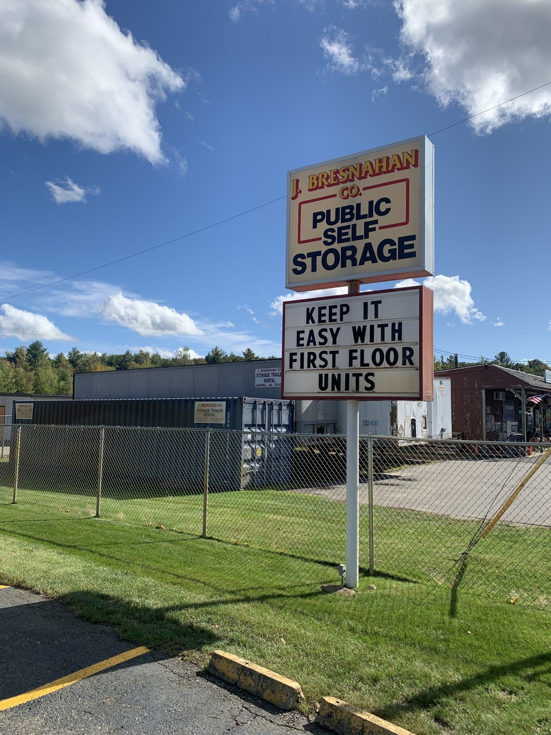 view of brick building with Plaistow facility and large Bresnahan Public Self Storage sign