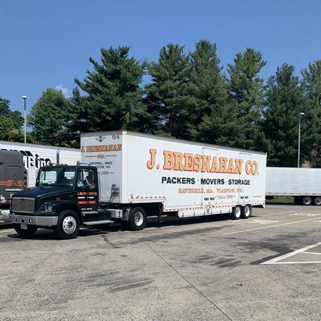 black truck pulling Bresnahan trailer