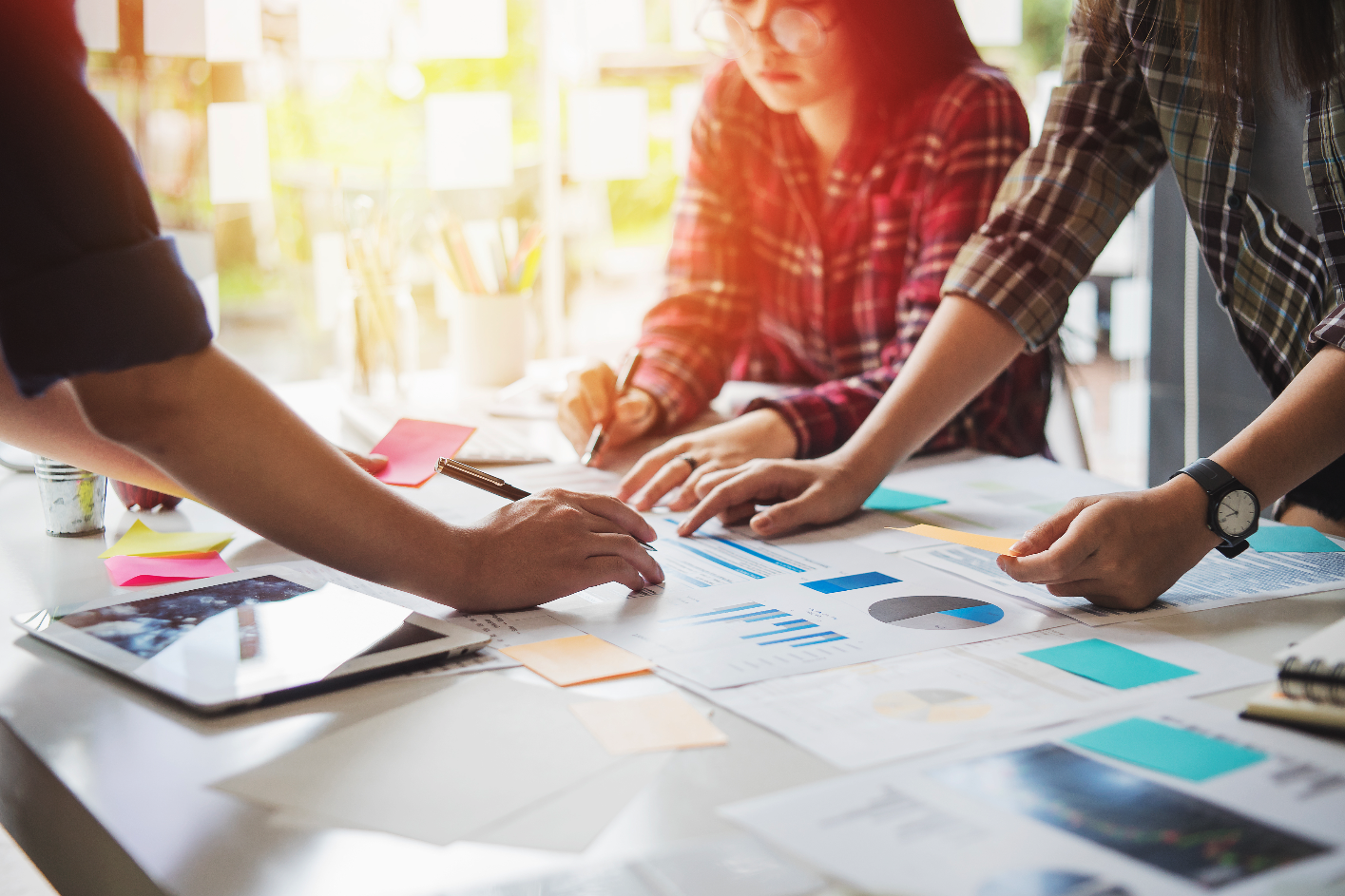 Three women working together on a hotel marketing campaign