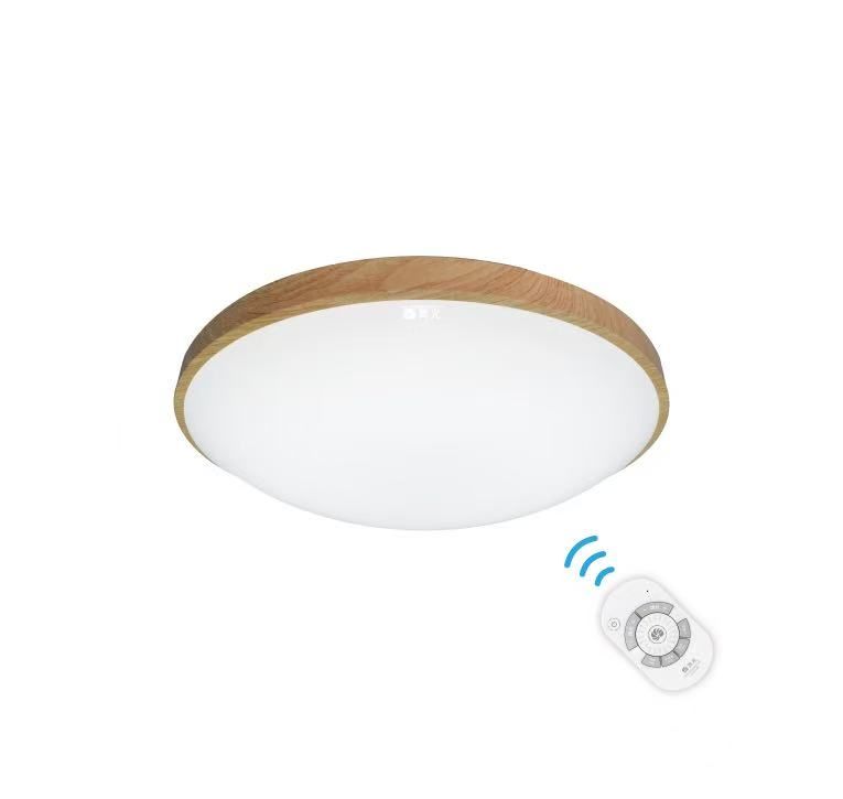 Round, wood-trimmed ceiling light with a remote control, emitting wireless signals.