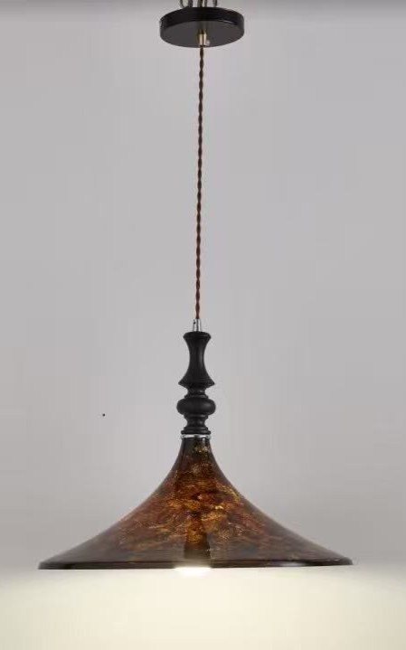 Brown and gold pendant light with a decorative, patterned shade, hanging from a ceiling.