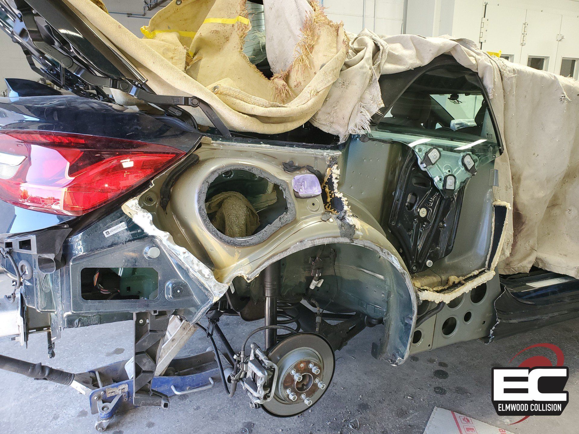 Elmwood Collision 2018 Buick Cascada with damaged quarter panel removed