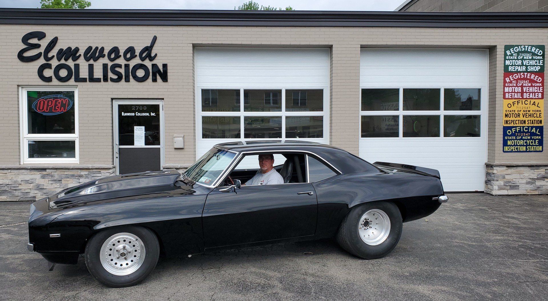 1969 Black Camaro Z/28 parked in front of Elmwood Collision at 2700 Elmwood Avenue Buffalo, New York