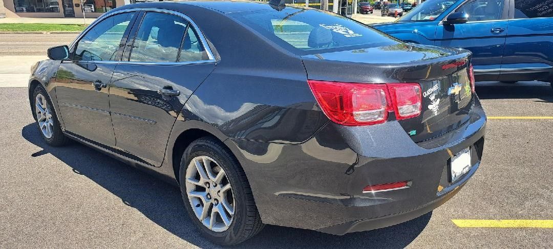 Vehicle parked outside Elmwood Collision in Kenmore NY after auto body repairs and painting.