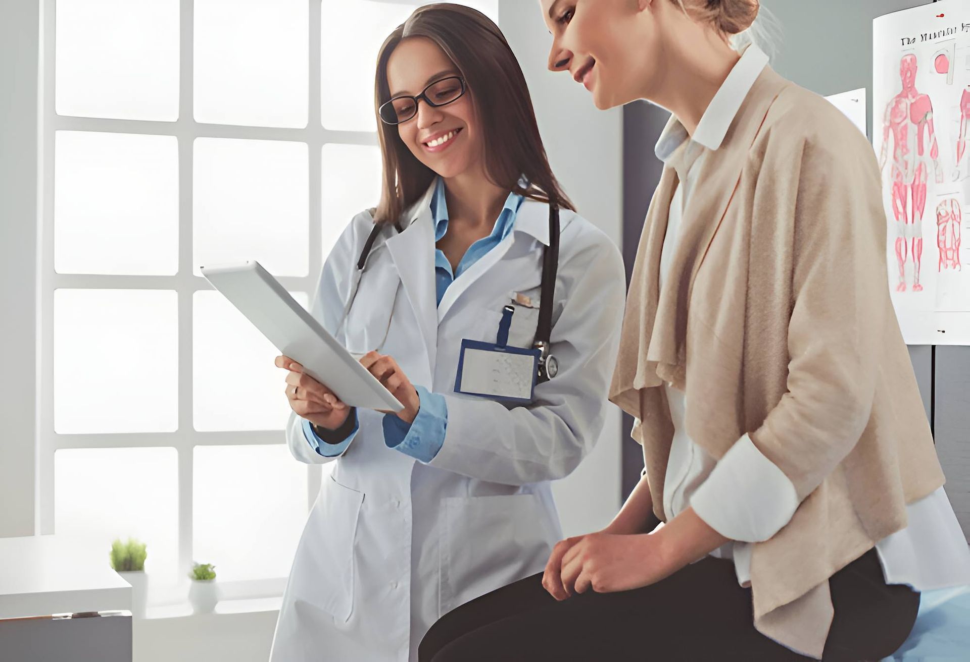 A Doctor is Talking to a Patient While Looking at a Tablet — Eastcoast Women's Centre in Townsville, QLD