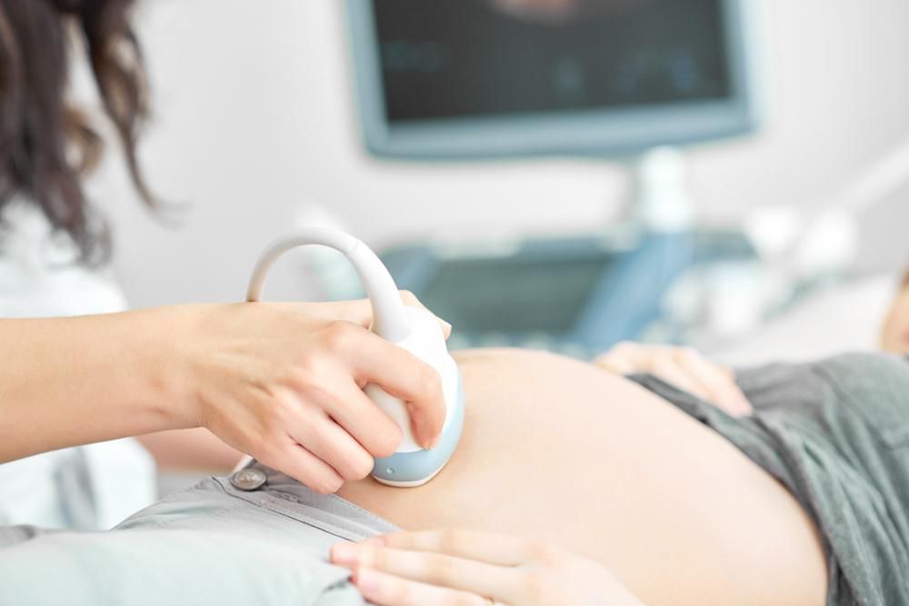 A Pregnant Woman Receiving an Ultrasound — EastCoast Women's Centre In Bundaberg, QLD