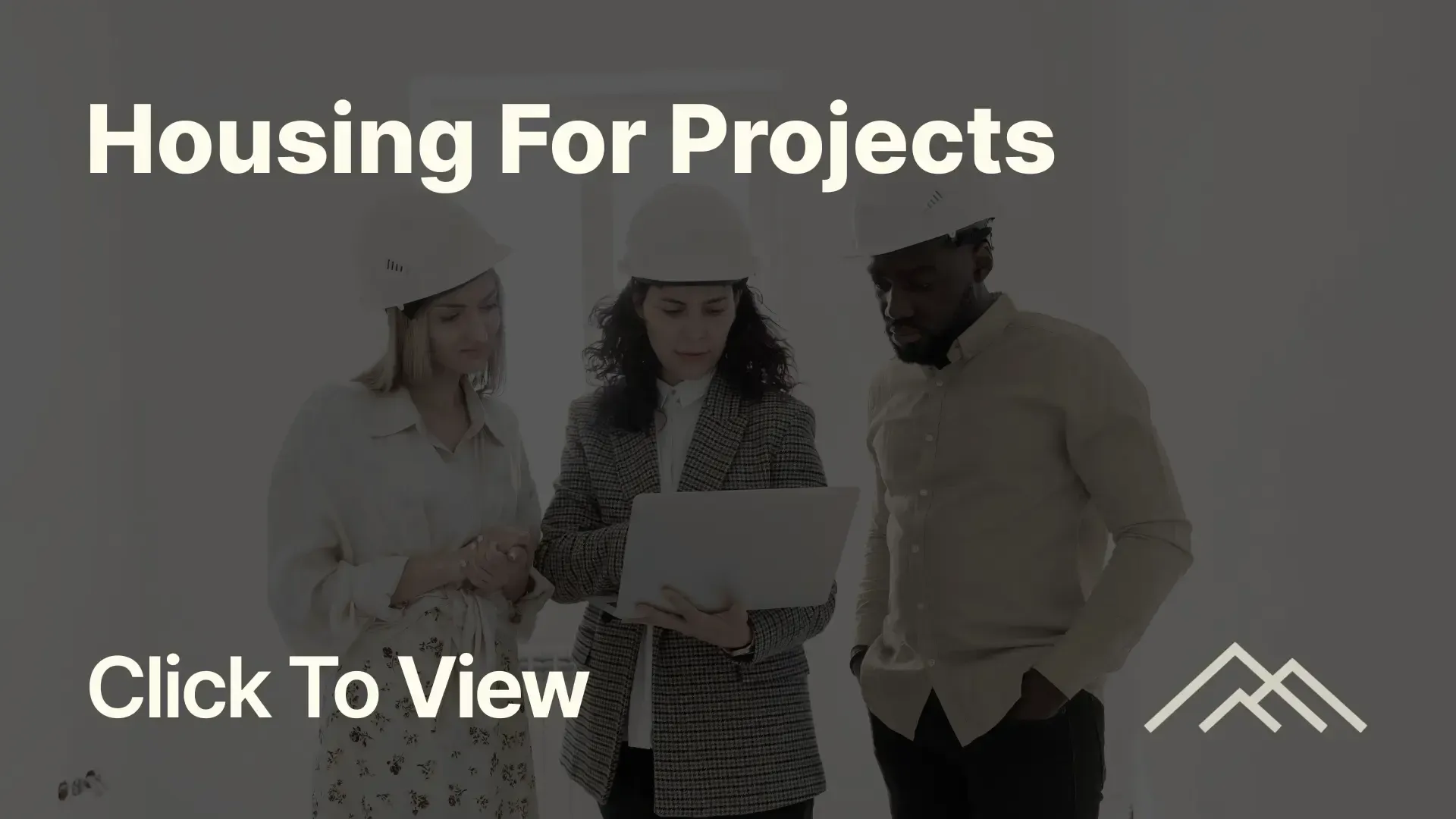 Homeshare team reviewing housing plans on site for project accommodation solutions
