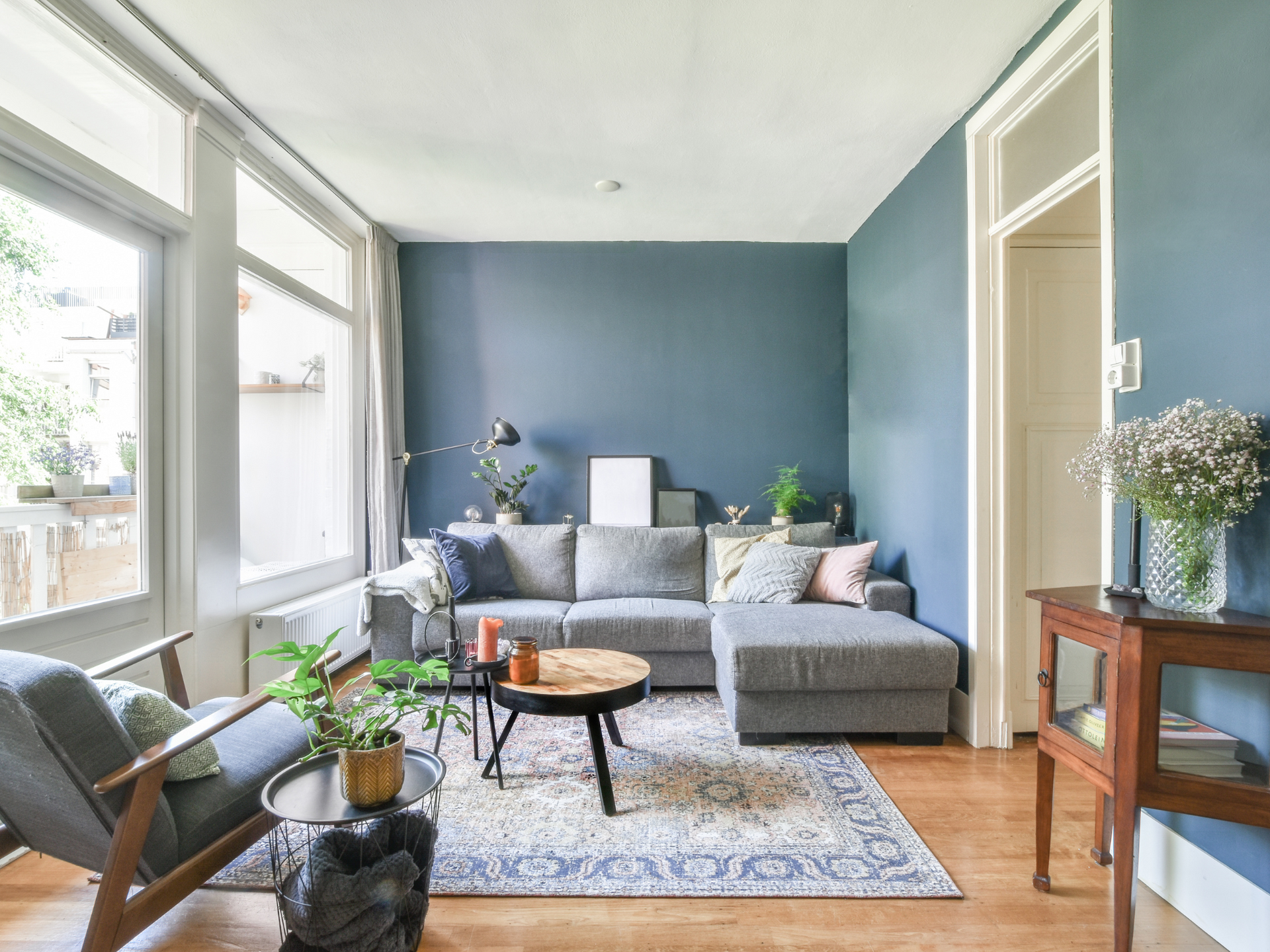 A freshly painted living room with blue walls.