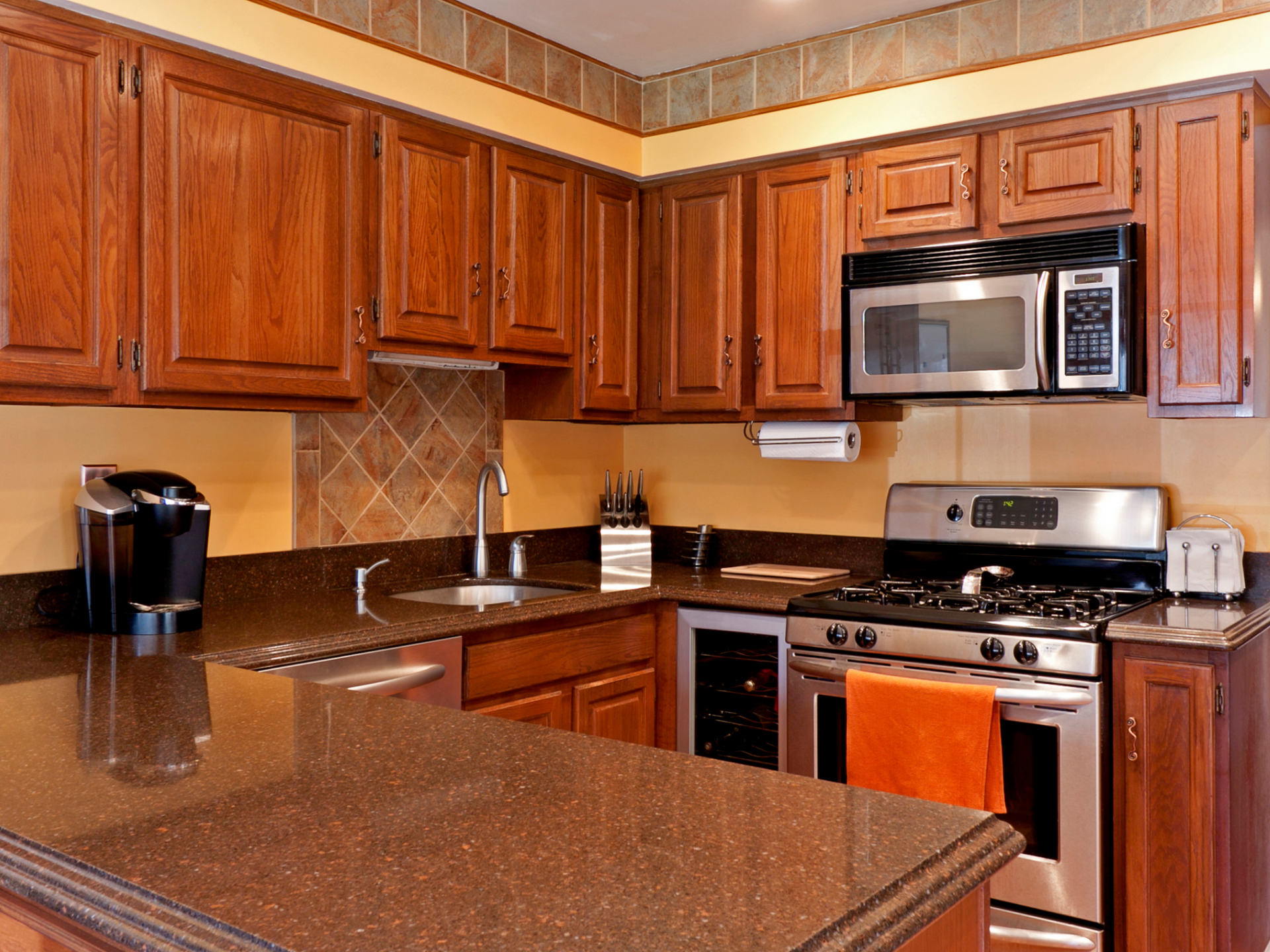 Unique paint color kitchen with wooden cabinets