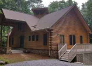 Green and Brown Cabin painted by Handy Man Xpress in Western North Carolina