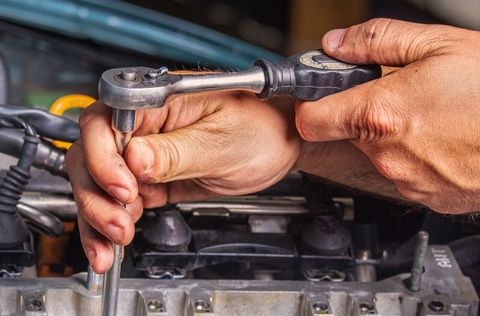 Mechanic repairing a car engine