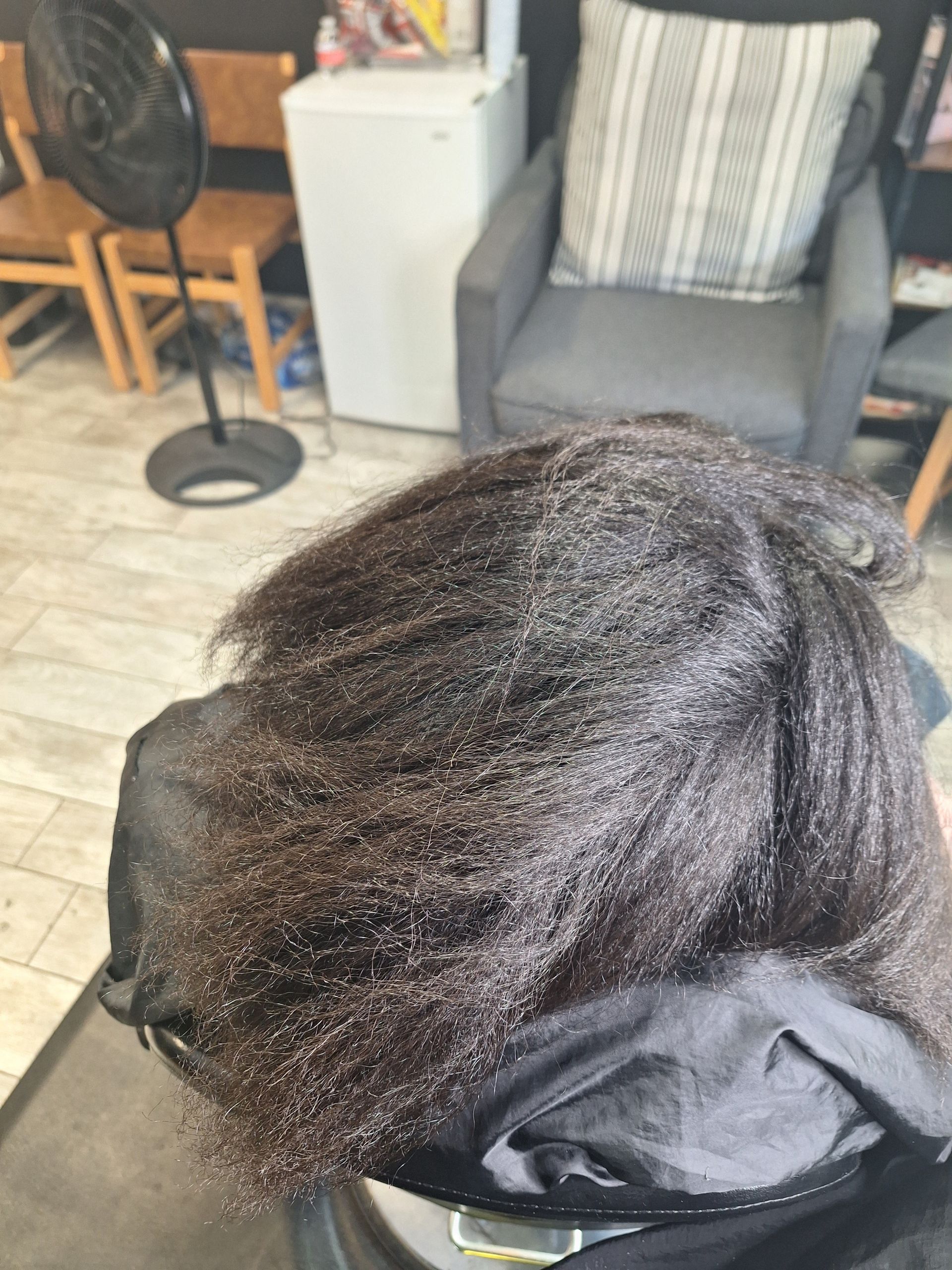 A close up of a person 's hair in a salon.