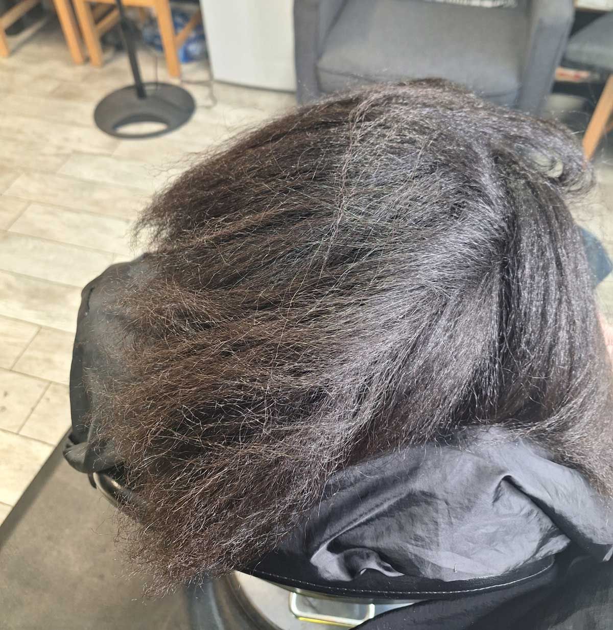 A close up of a person 's hair in a salon.