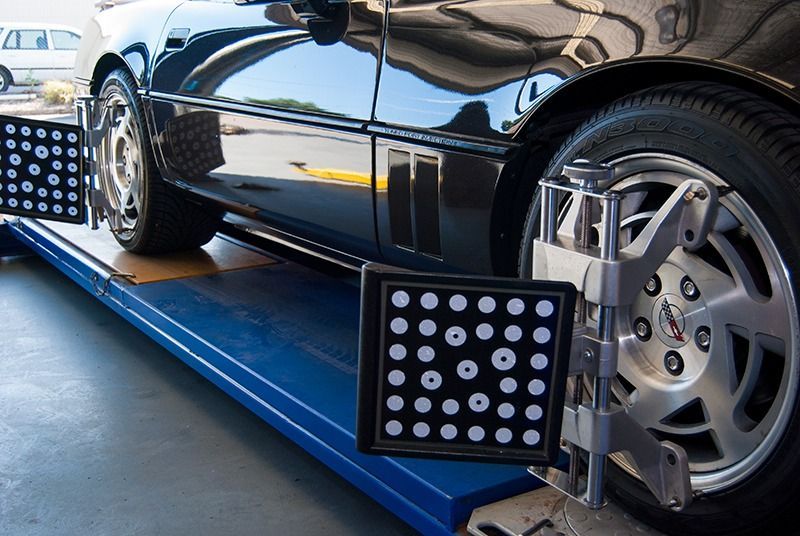A Car is Being Adjusted by a Machine in a Garage — Border Power Steering Service In Lavington, NSW